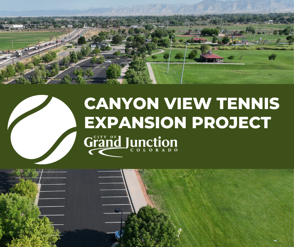 Ariel view of a park and parking lot with green grass. Text on graphic. 