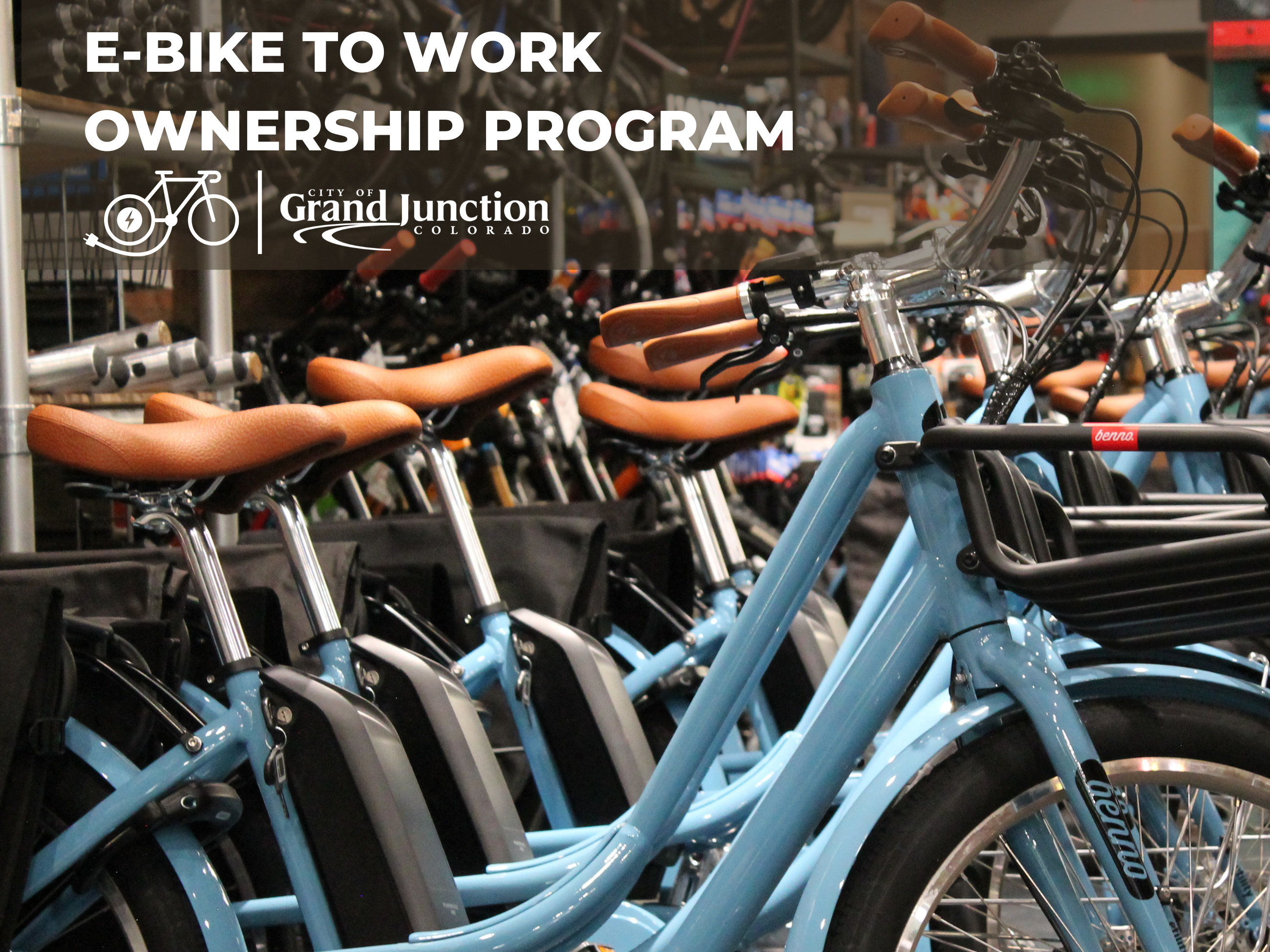 Multiple blue bikes lined up inside a building. Text on graphic. 