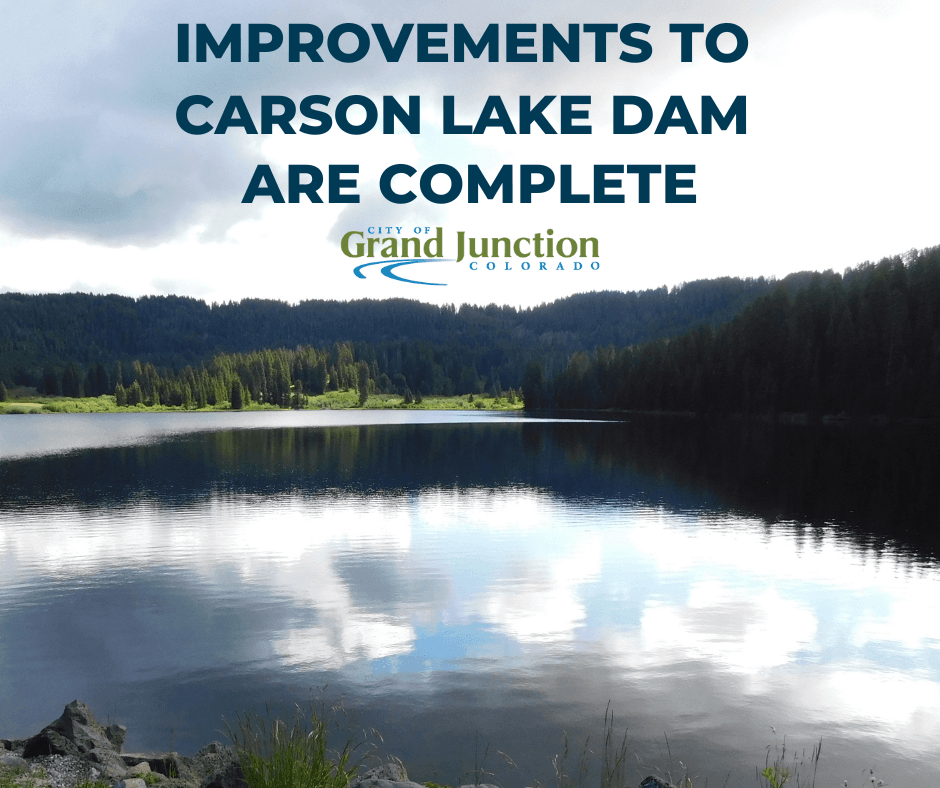 A lake surrounded by trees. Text on the graphic. 