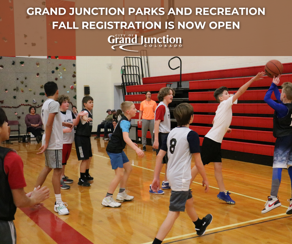 Students playing basketball inside a gym. Text on graphic. 