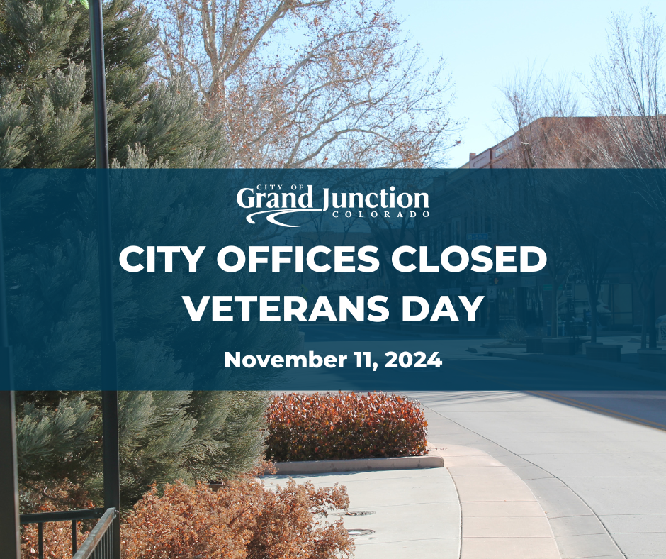 The outside of City Hall with text on the graphic. City Offices Closed Veterans Day