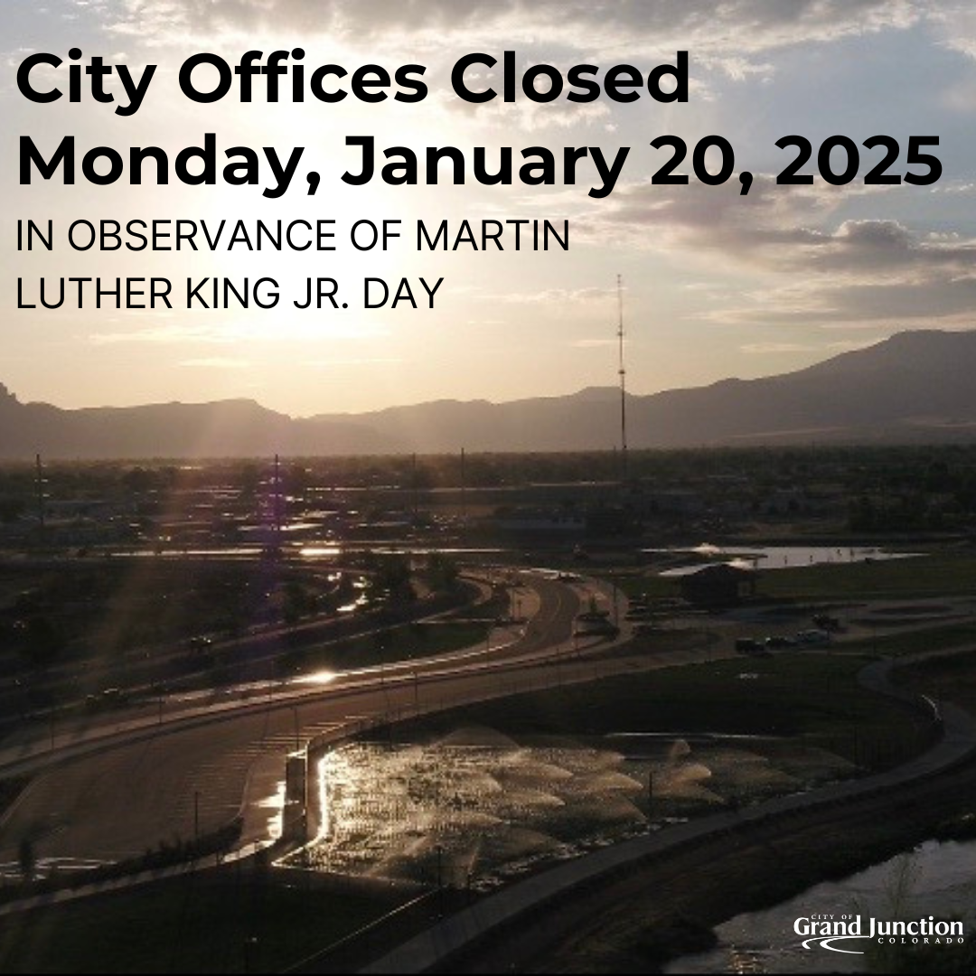 Aerial view of Grand Junction looking across the skyline into the sunset. Text on graphic.