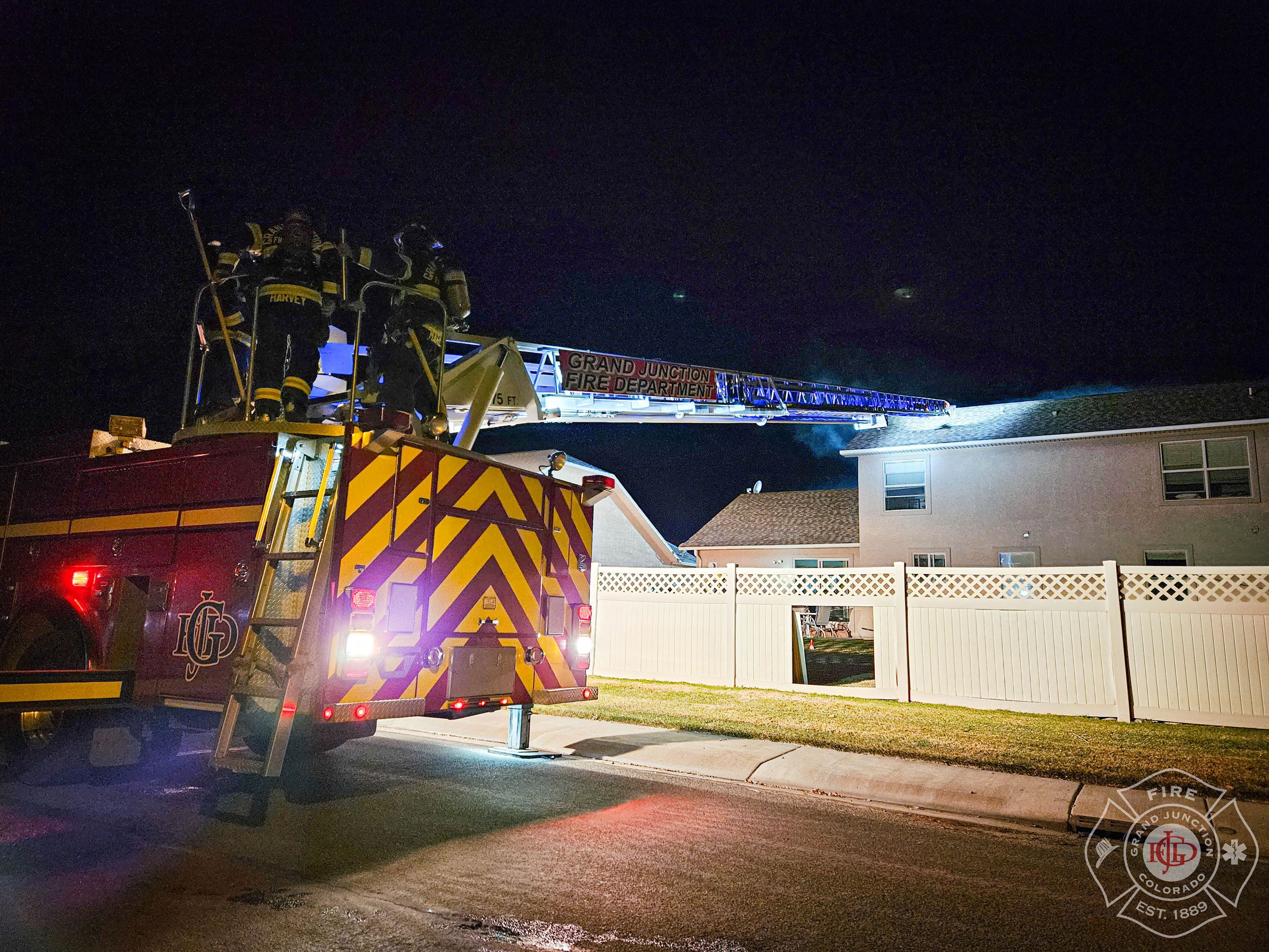 A GJFD ladder truck outside a residential home