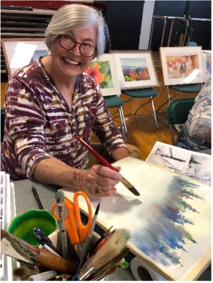 Woman holding art piece