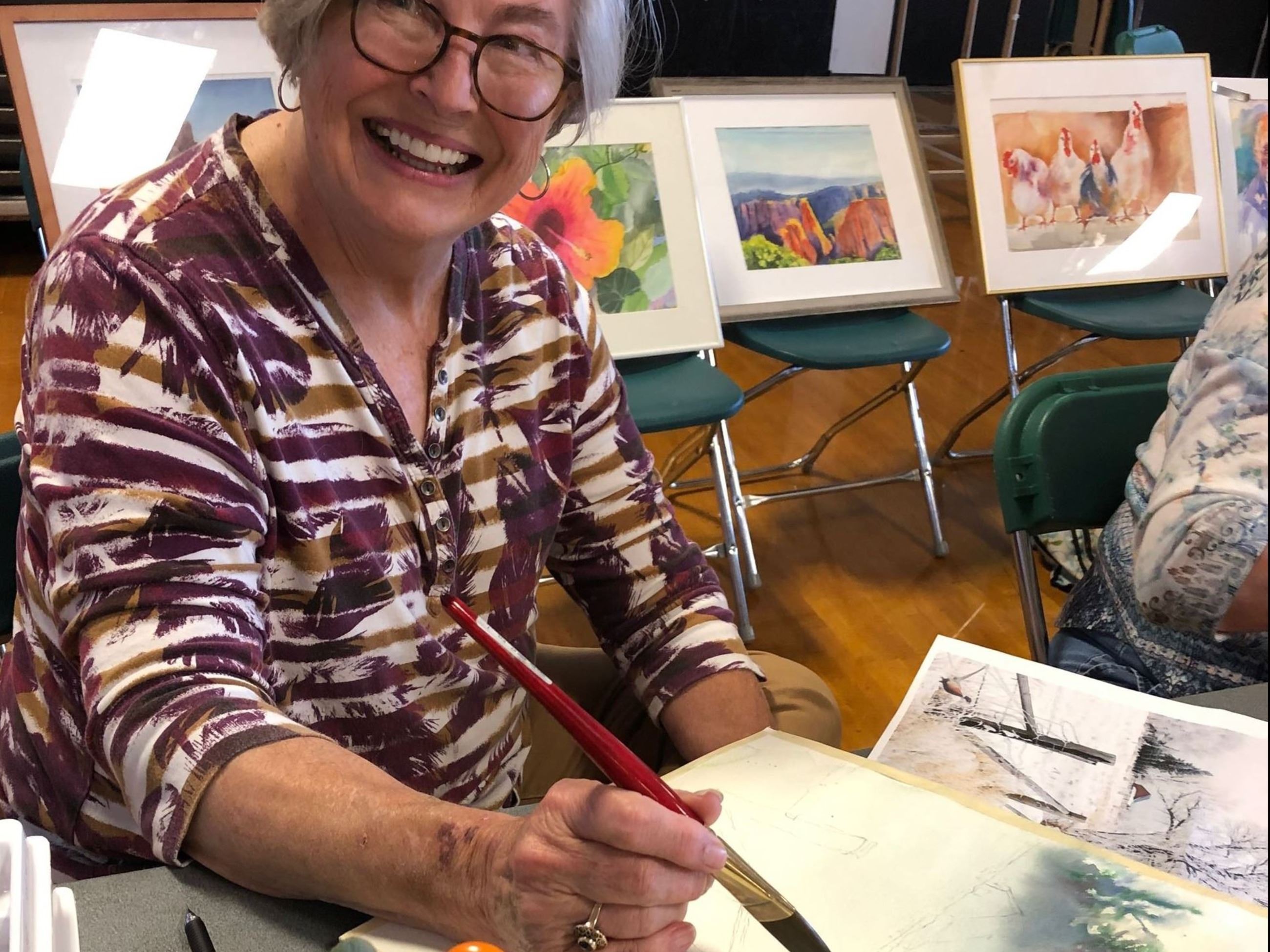 Woman holding art piece