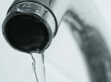 Close up of water faucet