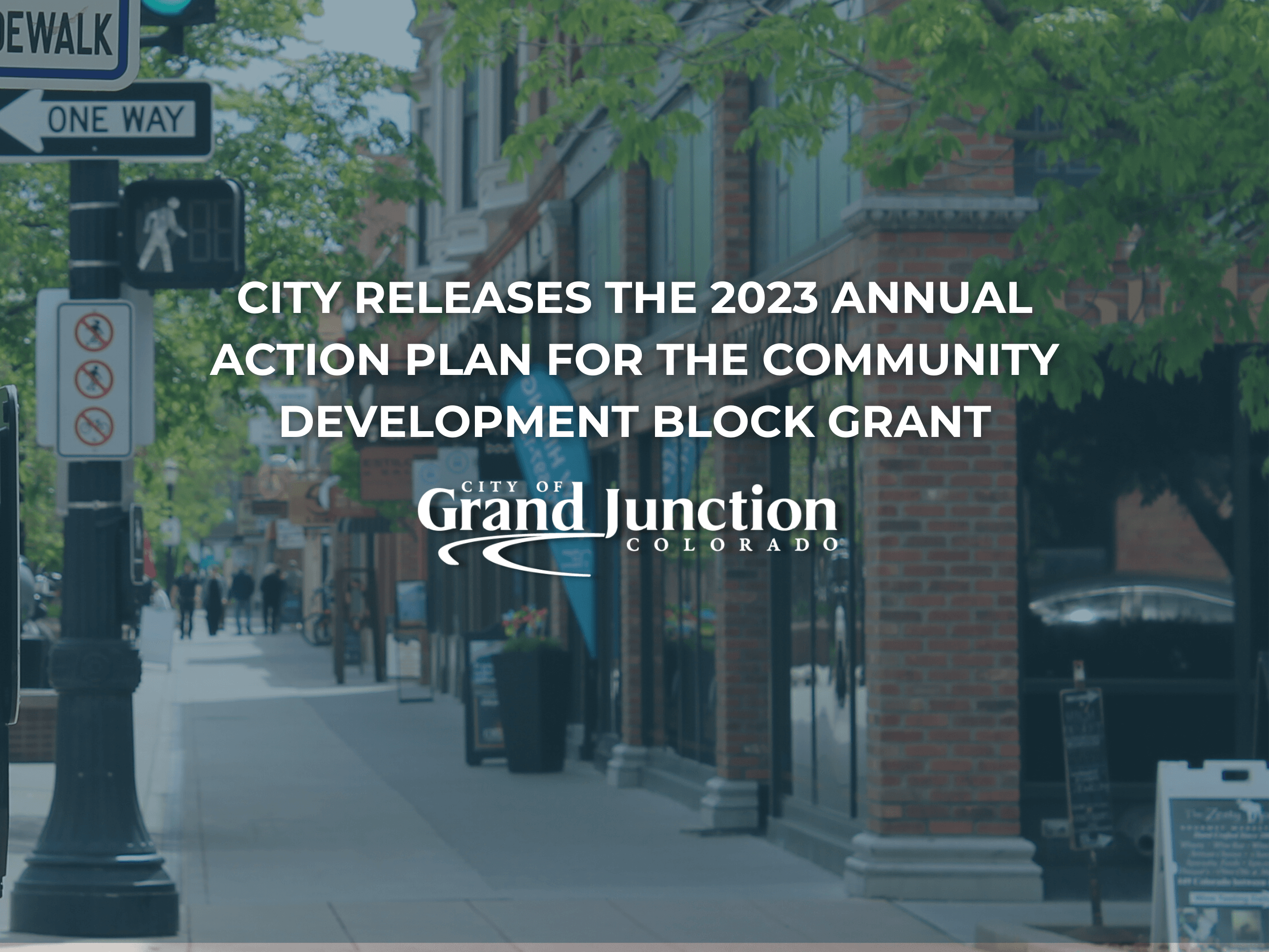 Brick building with windows and crosswalk sign. Text on image.