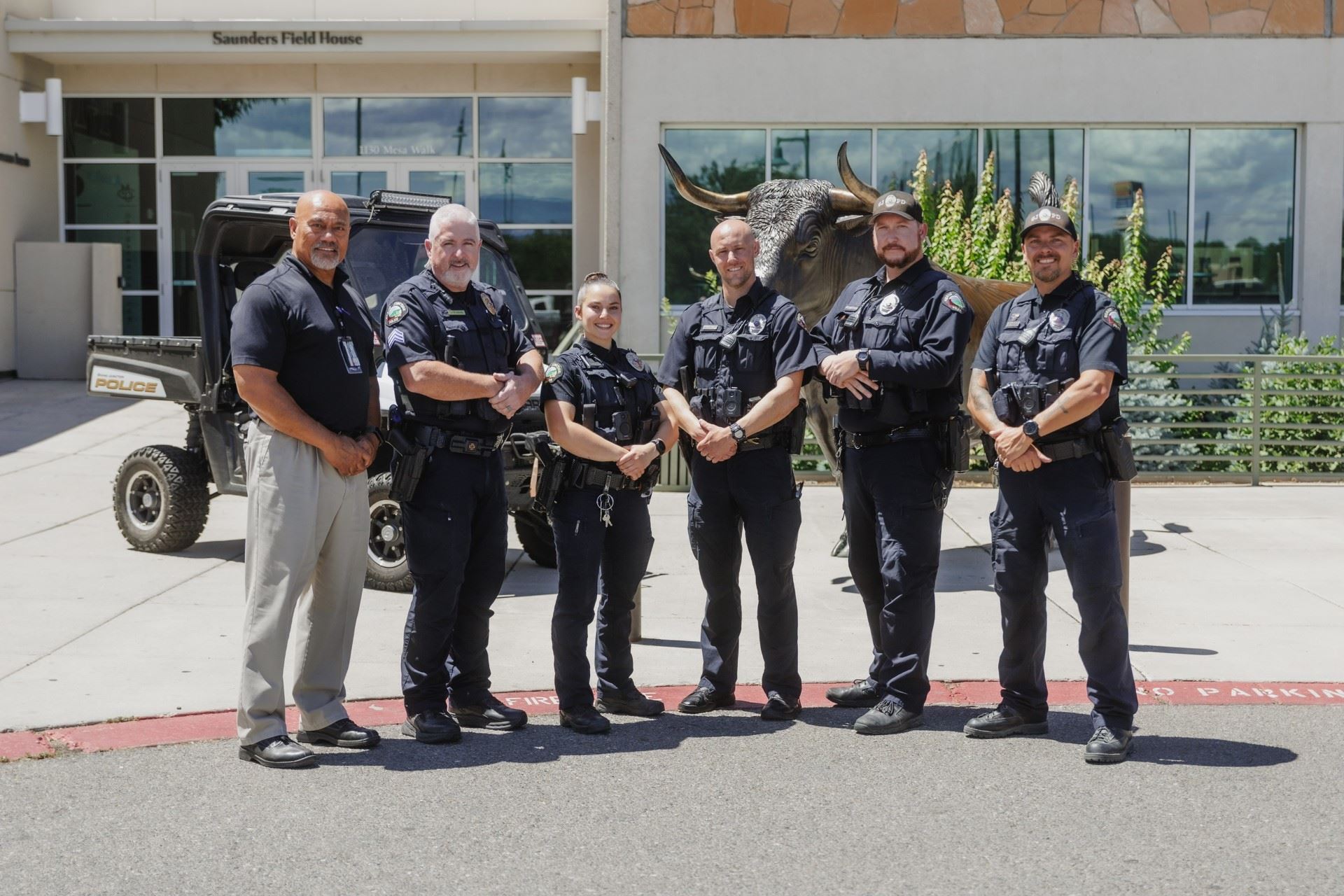grand junction police officers and CMU Head of Security in front of building